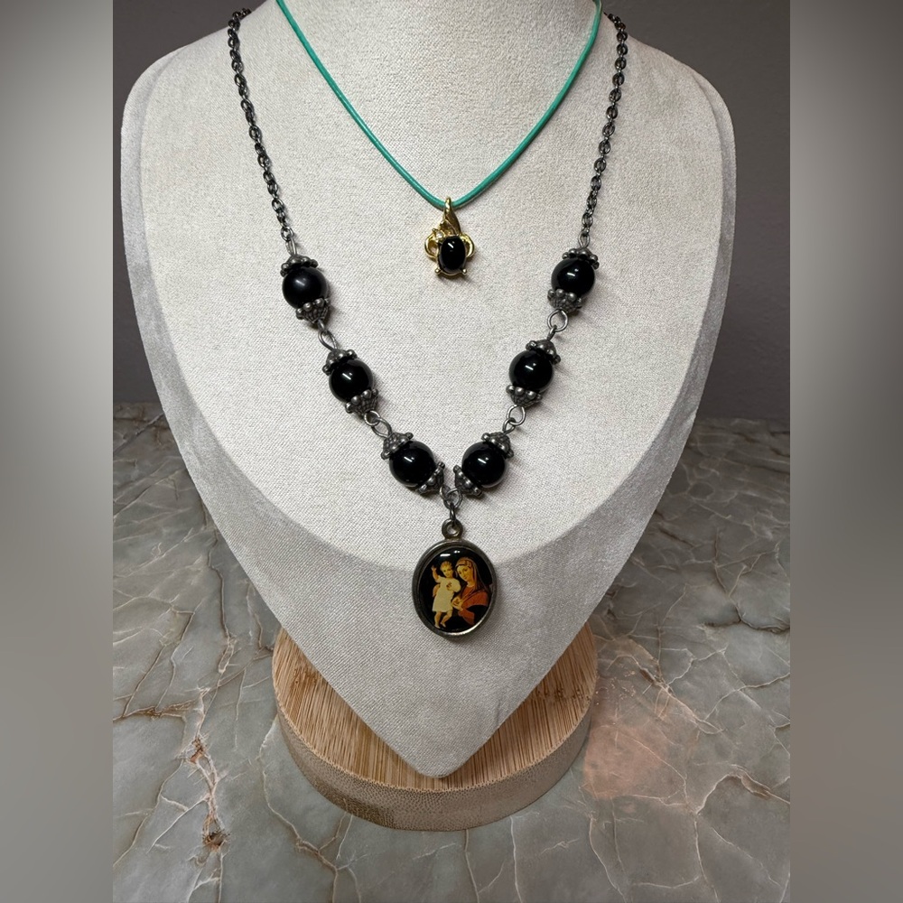 Elegant Black Beaded Necklace with Artistic Pendant